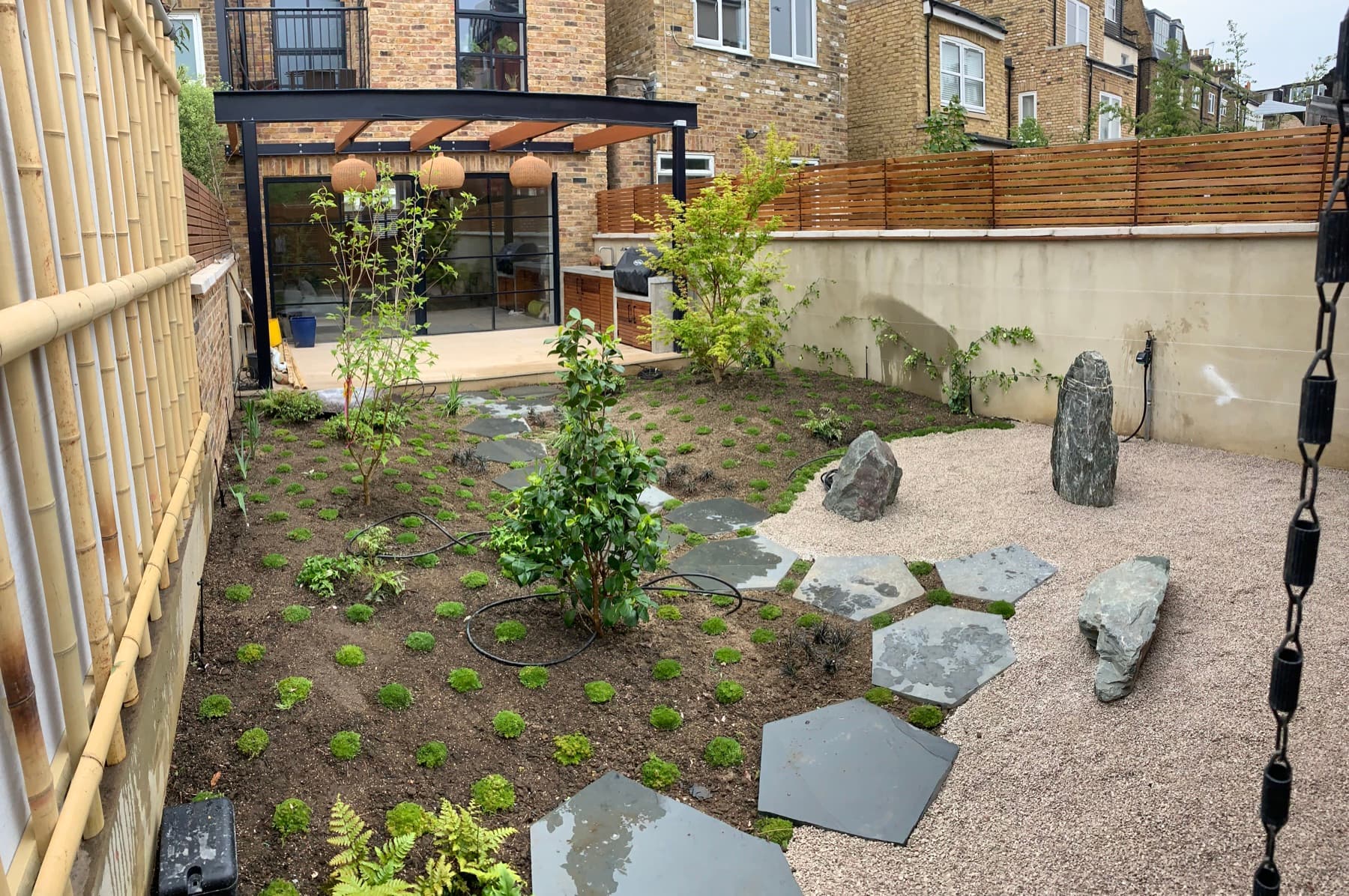Sandstone stepping stones set into a manicured lawn